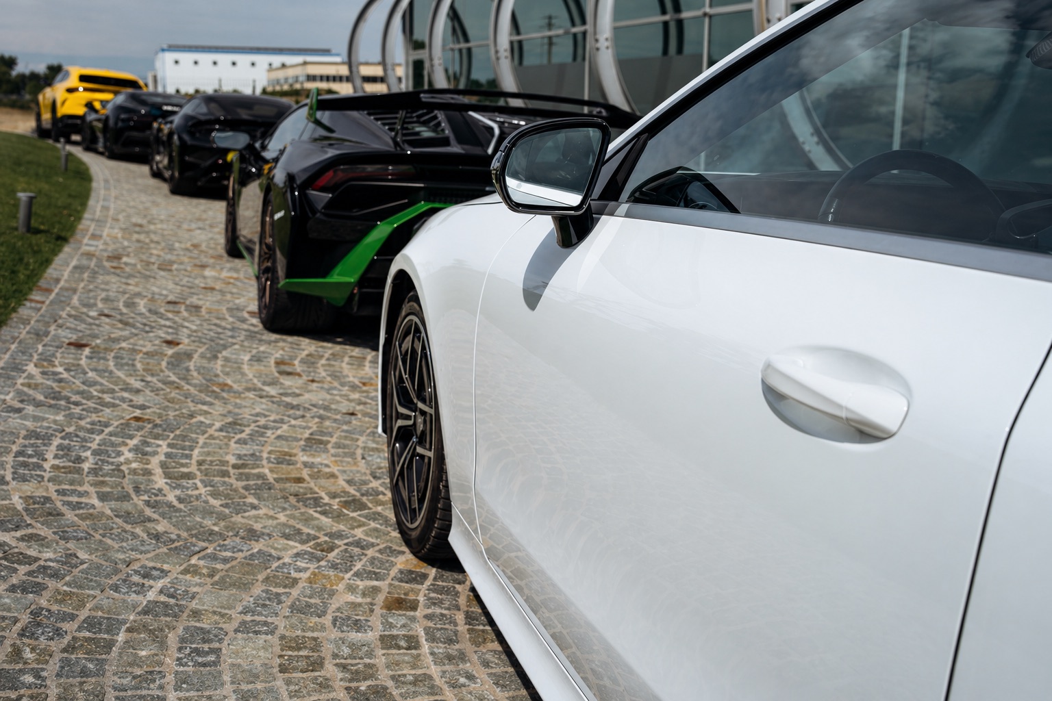White sports car on the Tuscan driveway